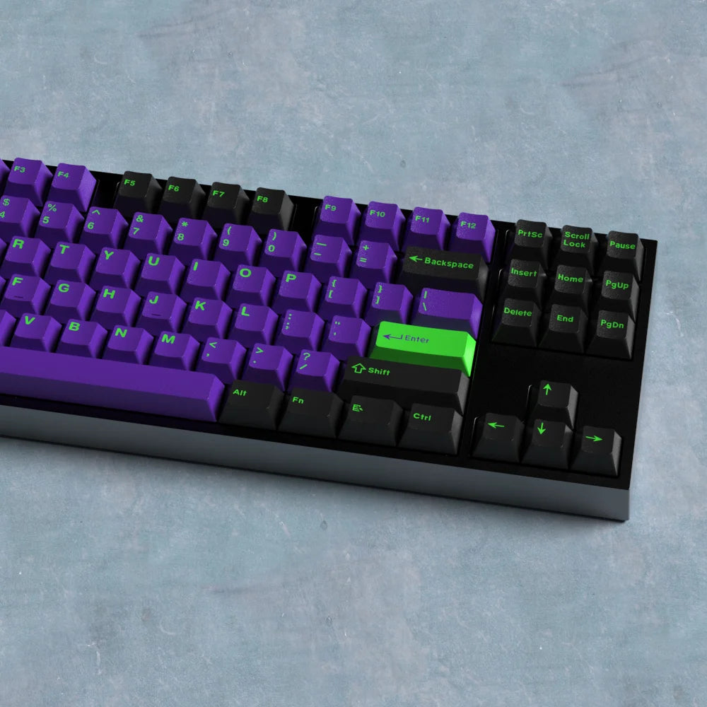 Mechanical keyboard with purple and black keys on a gray surface