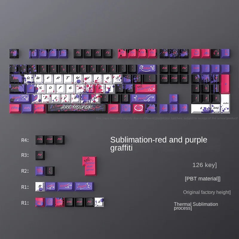 Keyboard keycaps with red and purple graffiti design on a gray background