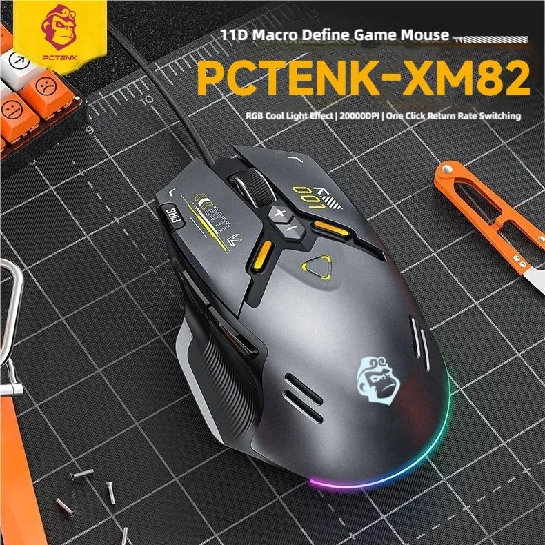 PCTENK-XM82 gaming mouse on a grid background with tools around