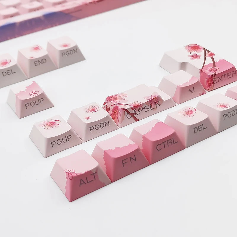 Set of pink keyboard keys with floral designs on a white background