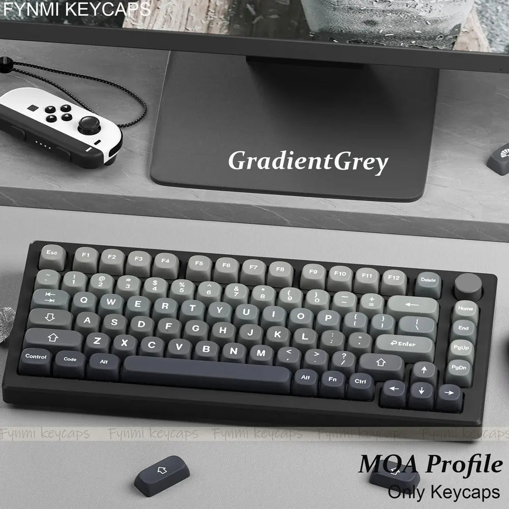 Mechanical keyboard with gradient gray keycaps on a desk with 'GradientGray' mouse pad.