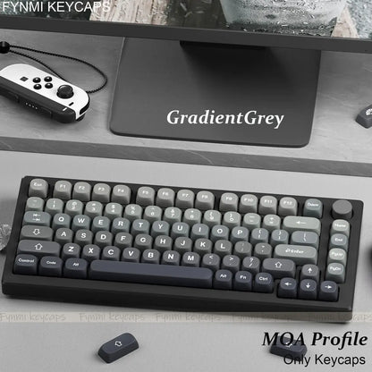 Mechanical keyboard with gradient gray keycaps on a desk with 'GradientGray' mouse pad.