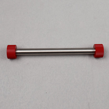 Metal bar with red ends on a gray background