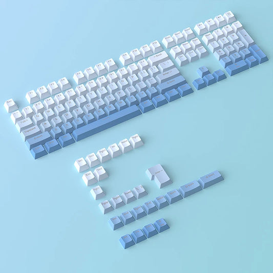 Set of mechanical keyboard keycaps on a light blue background