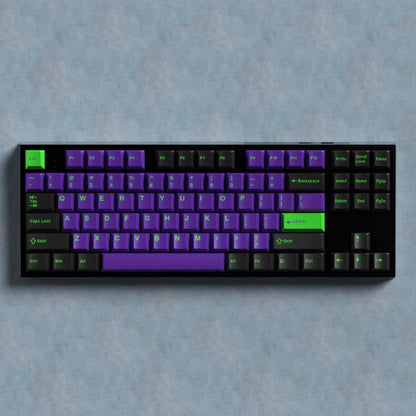 Mechanical keyboard with purple and green keys on a gray background