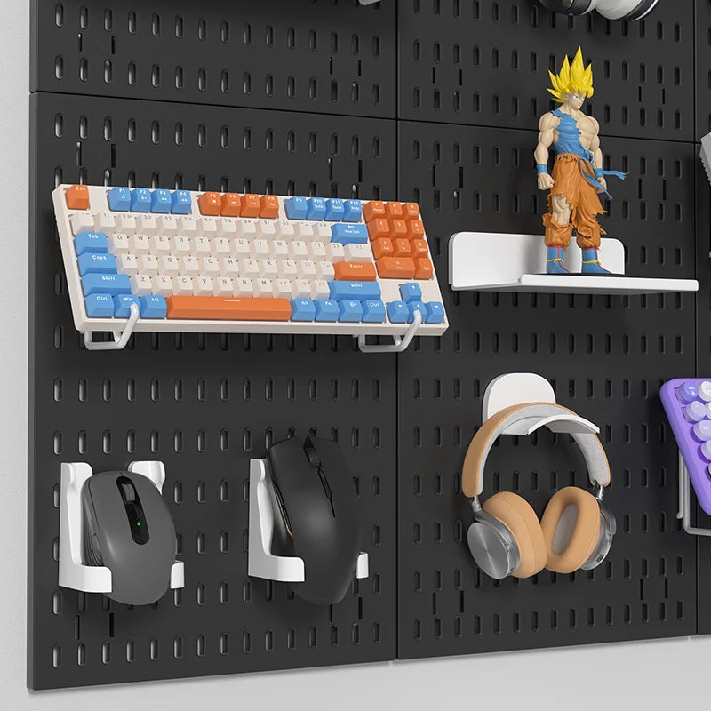 Pegboard with various items including a keyboard, figurine, mouse, and headphones.