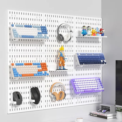 White pegboard wall with shelves holding various items including keyboards, headphones, and figurines.