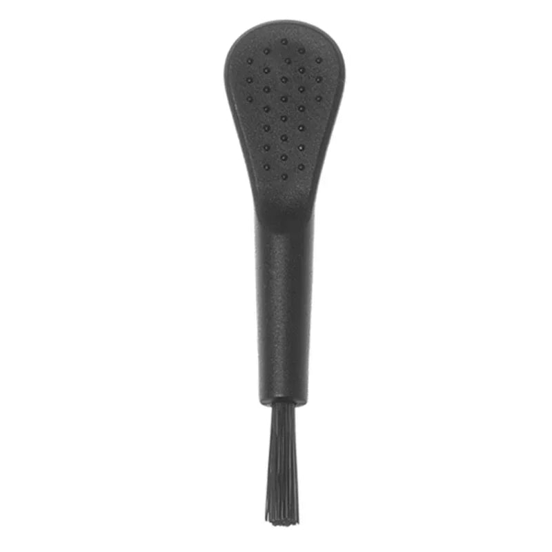 Black shoe polish brush on a white background