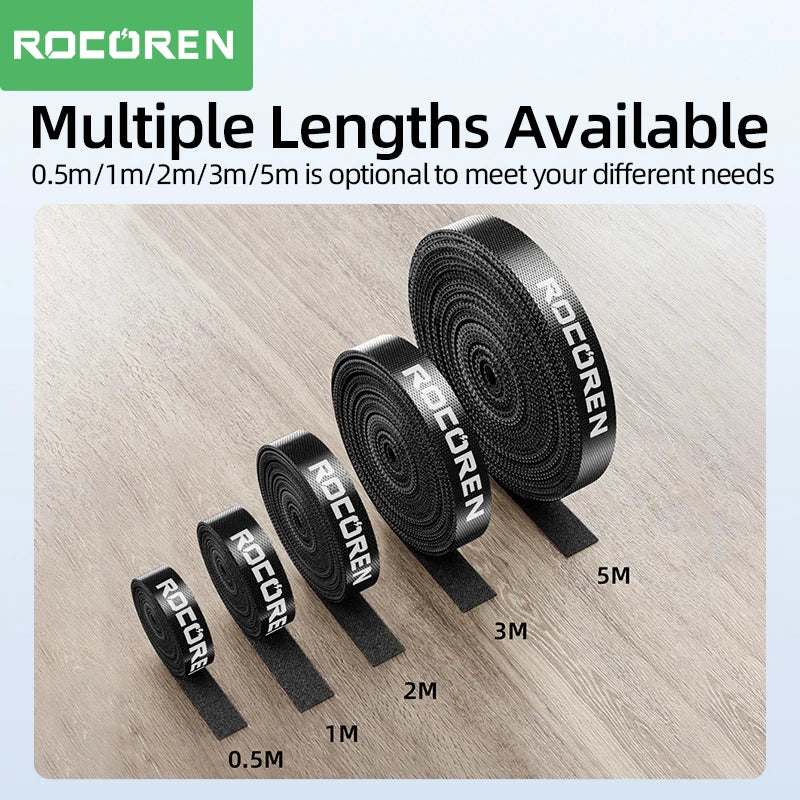 Set of black_ROCOREN straps with varying lengths on a wooden surface