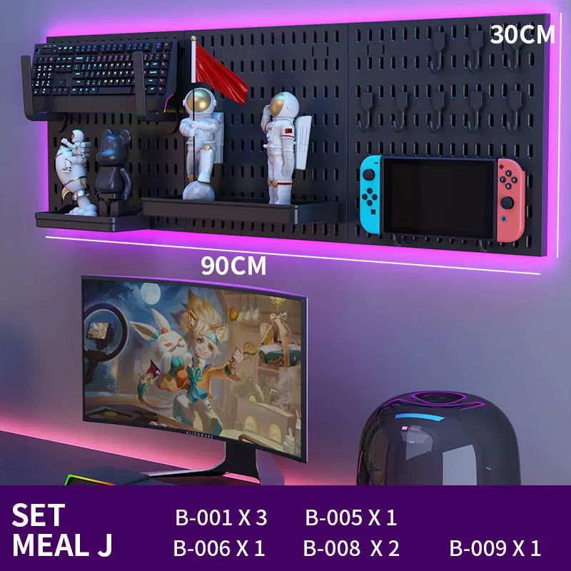 Gaming setup with monitor, keyboard, and decorative items on a wall shelf.