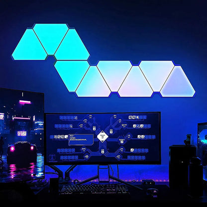 Geometric LED light panels in a blue gradient above a computer setup.