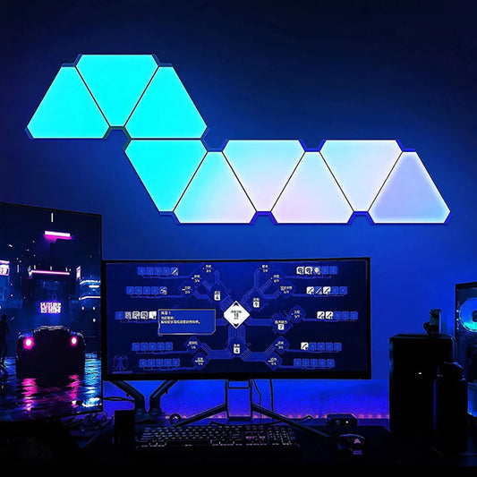 Geometric LED light panels in a blue gradient above a computer setup.