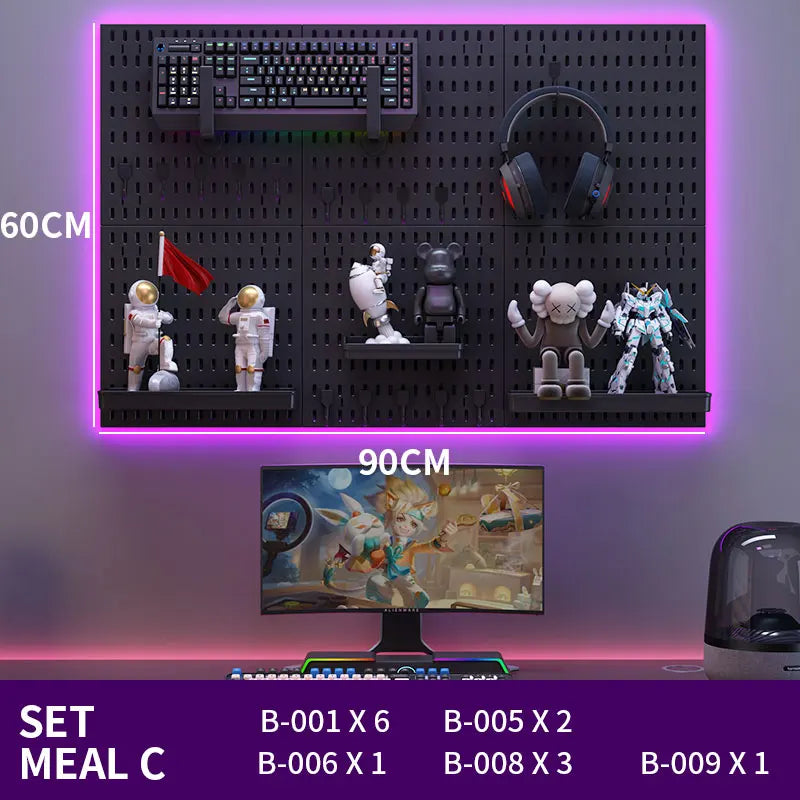 Gaming setup with monitor, keyboard, mouse, and figurines on a pegboard against a purple background.