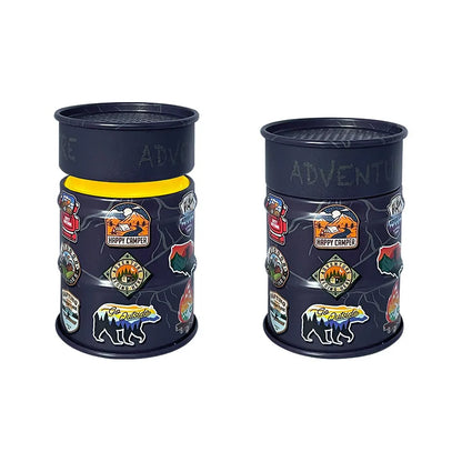 Two dark blue cylindrical containers with colorful stickers on a white background