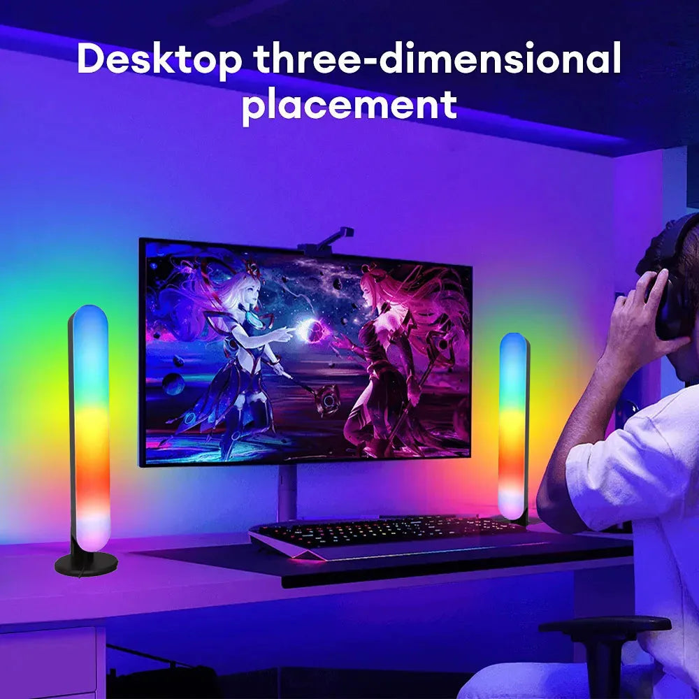 Person using a computer setup with RGB lighting in a room.