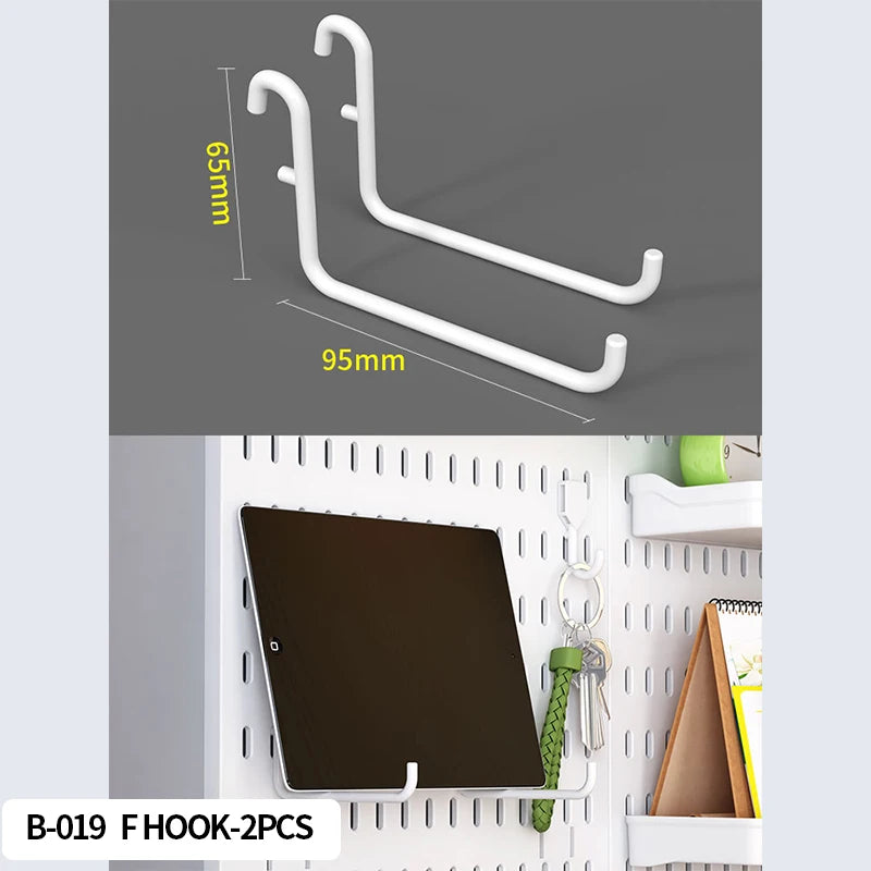 White hooks with measurements on a gray background, used for wall organization with a tablet and keys.