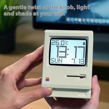 Digital clock with temperature display held by a hand, with text overlay.