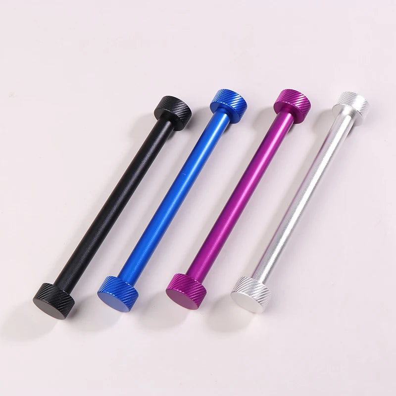 Four metal rods in black, blue, purple, and silver on a light pink background