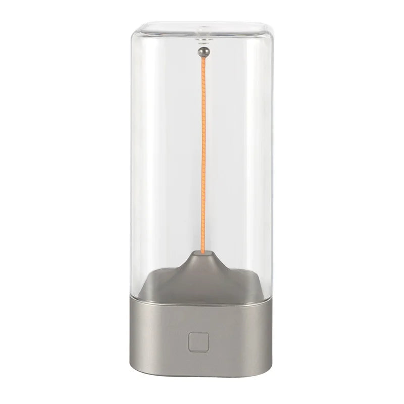 Clear glass container with a metallic base on a white background