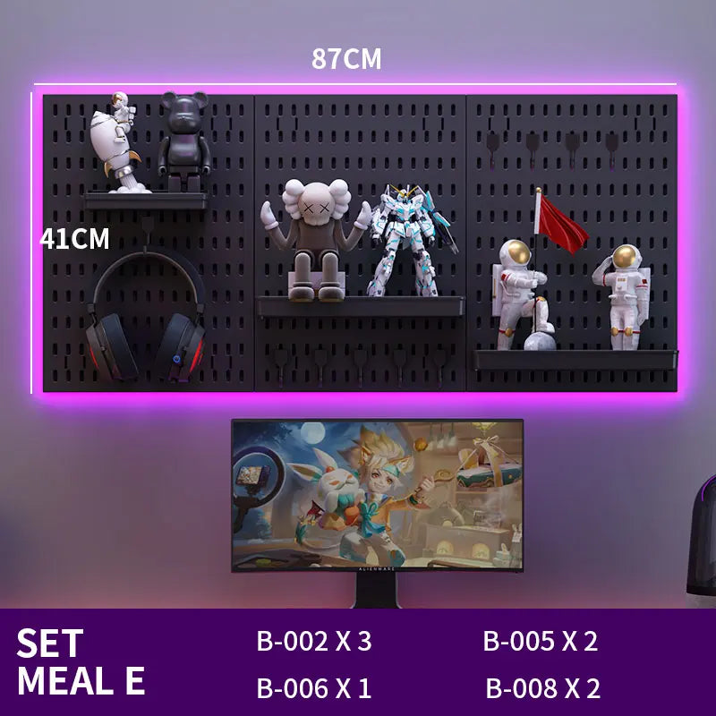 Wall-mounted pegboard with various action figures and a TV displaying a cartoon, with dimensions indicated.