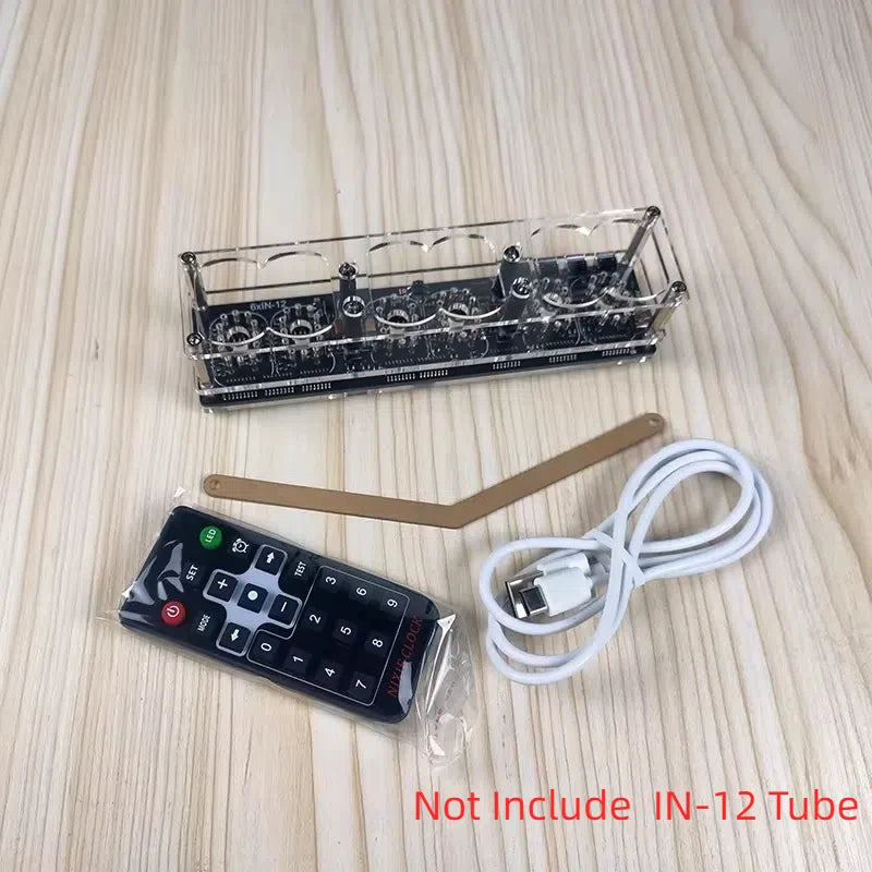 Electronic components including a remote control, clear plastic tray, and USB cable on a wooden surface.