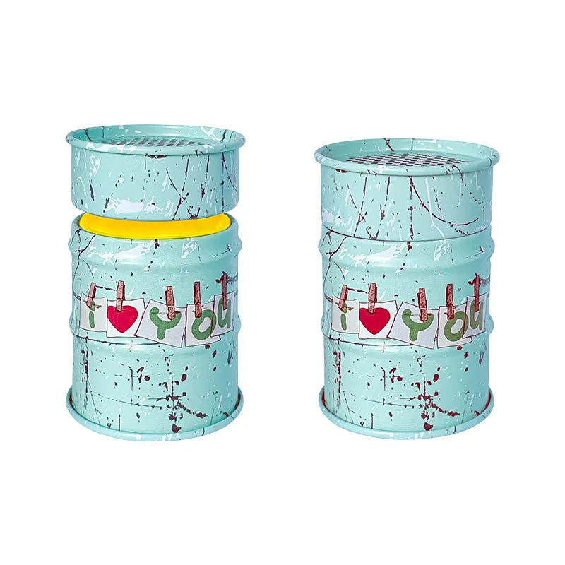 Two turquoise cylindrical containers with decorative elements on a white background