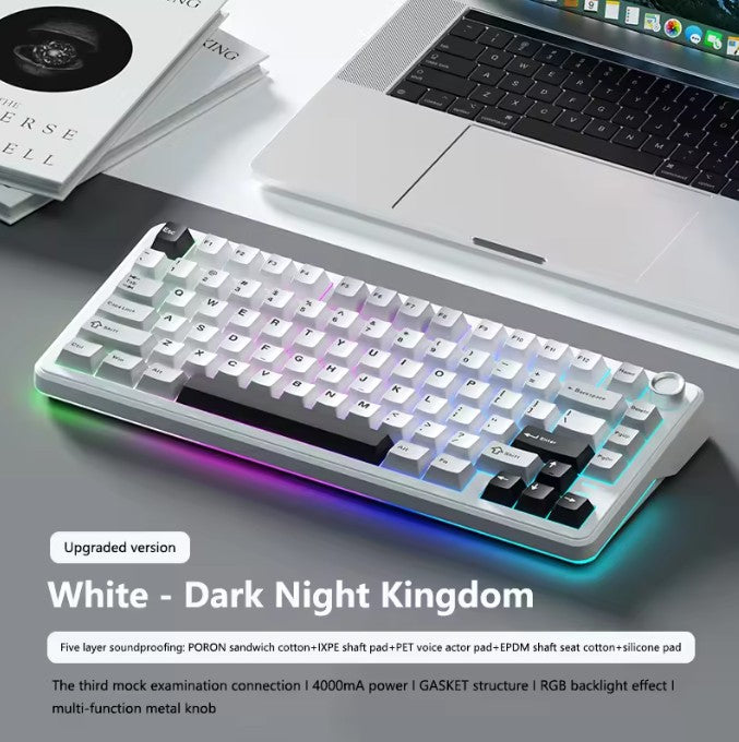 Mechanical keyboard with RGB backlighting on a desk with a laptop and books.