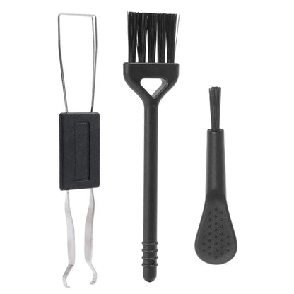 Set of three black cleaning brushes on a white background