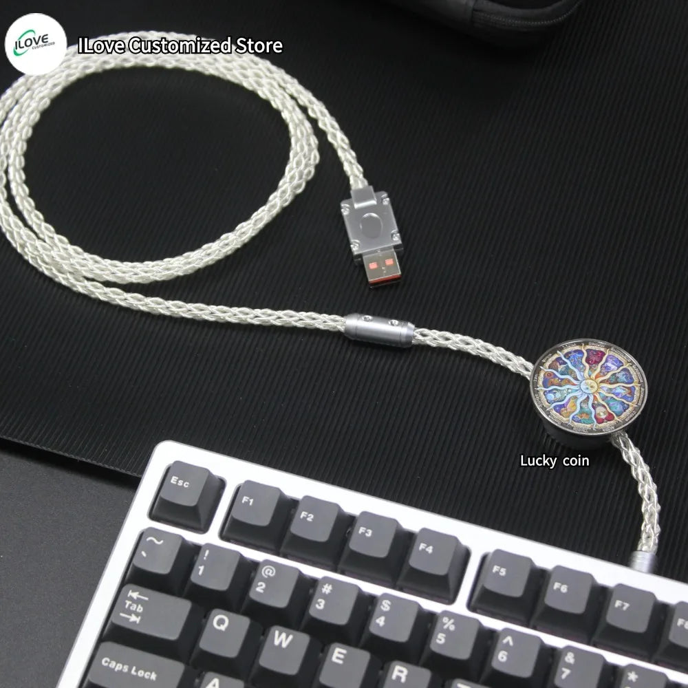 USB cable with a decorative end featuring a 'Lucky coin' design on a black surface.