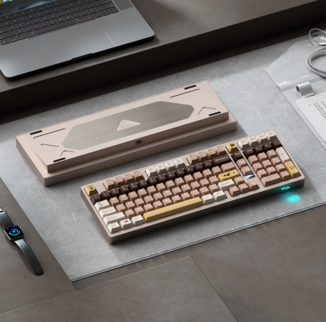 Mechanical keyboard on a desk with a laptop and mouse in the background
